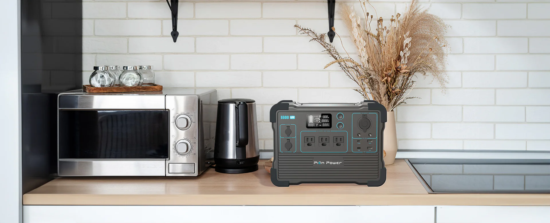 E600LFP power station running household kitchen appliances like a coffee maker, toaster, and blender with 1200W AC pure sine wave output.