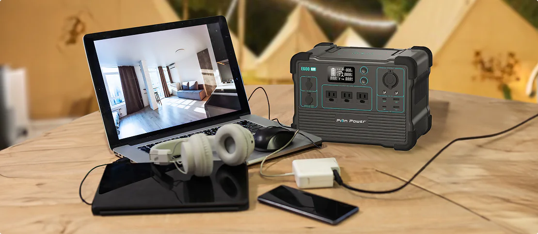 Portable power station with 11 versatile output ports for charging multiple devices, including AC, DC, USB, and wireless options.