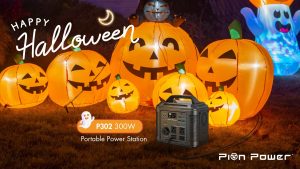 A Pion Power P302 300W portable power station displayed in front of glowing inflatable jack-o'-lanterns, with a "Happy Halloween" message.